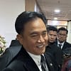Menteri Koordinator Bidang Hukum, HAM, Imigrasi, dan Pemasyarakatan Yusril Ihza Mahendra menjawab pertanyaan wartawan di kantornya, Jakarta, Jumat (6/12/2024)